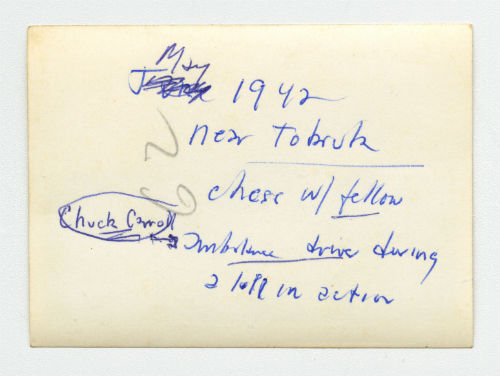 Arthur Howe, Jr. playing chess with Charles "Chuck" Carroll near Tobruk, Libya. Verso 2