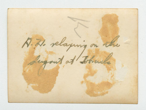 Arthur Howe, Jr. relaxing on the dugout at Tobruk, Libya. Verso