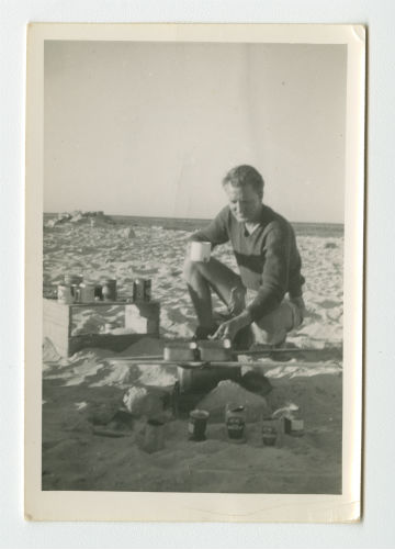 Dave Hyatt cooking some of the spoils of Marsa Matruh, Egypt. Recto