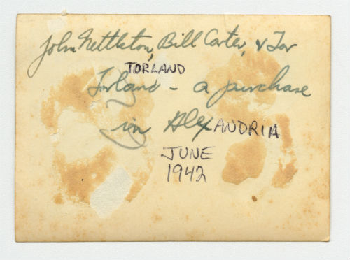 John Nettleton, Bill Carter and Torleif "Tor" Torland making a purchase in Alexandria, Egypt. Verso