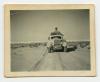 Arthur Howe, Jr.'s staff car leading a convoy. Recto
