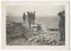 Group of men standing near ruins