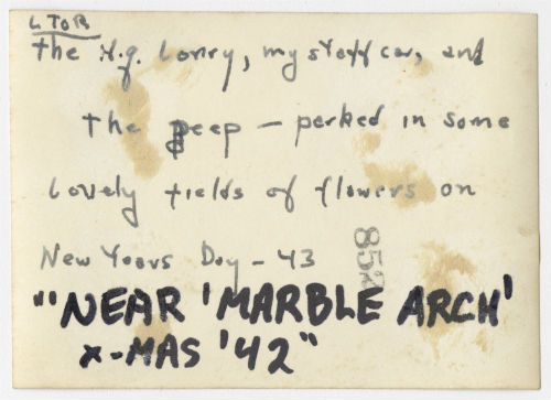 The headquarters lorry, Arthur Howe, Jr.'s staff car and a jeep parked in a field of flowers. Verso