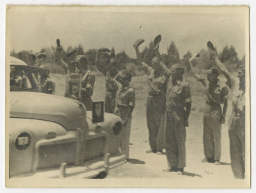 AFS volunteers cheering King George VI during the review in Tripoli. Recto