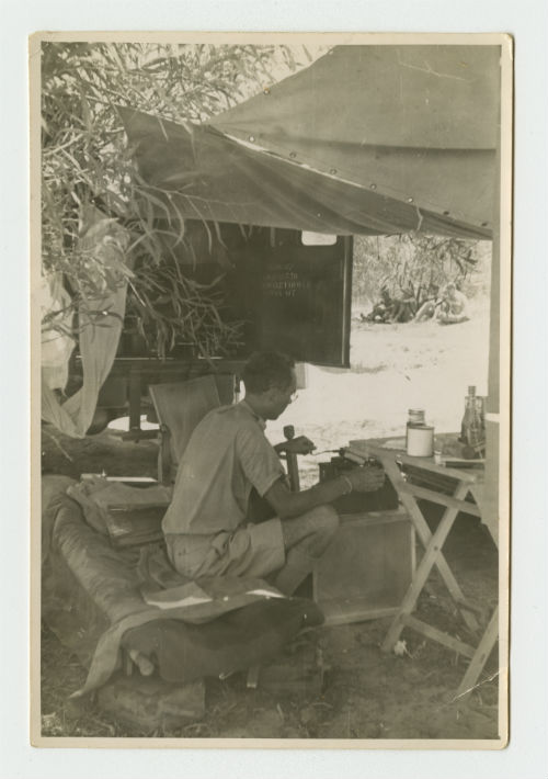 James Andrews writing letters home from the AFS Headquarters in Tunisia. Recto
