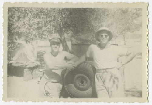 Unidentified individual and Bayard "Newport Nellie" King after the foot race near Al-Swani. Recto