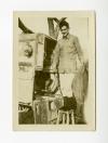 Phil Crawford standing on a stool behind an ambulance in Taisnil, France.