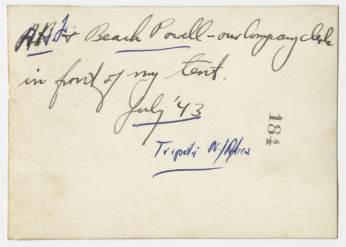Arthur Howe, Jr. in front of his tent with Charles Beach Powell near Tripoli, Libya. Verso