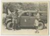Lester Collins and Arthur Howe, Jr. looking over Art's new car. Recto