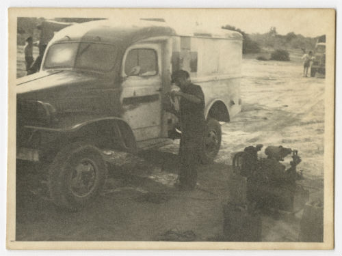 Painting an ambulance for Italy. Recto