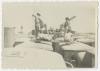 Men on vehicle roofs on the LST to Italy