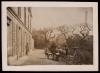 Men gathered on the terrace of 21 rue Raynouard with Eiffel Tower in background