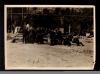 Men gathered around planks of wood.