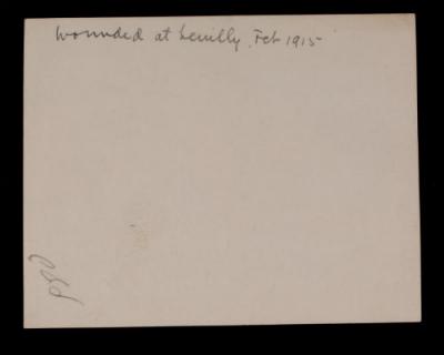 Wounded French soldiers with two French boys and a doctor (leaning over) in the background. Verso.