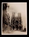 View of the Reims Cathedral (center),  the Grand Hotel (left), and rubble